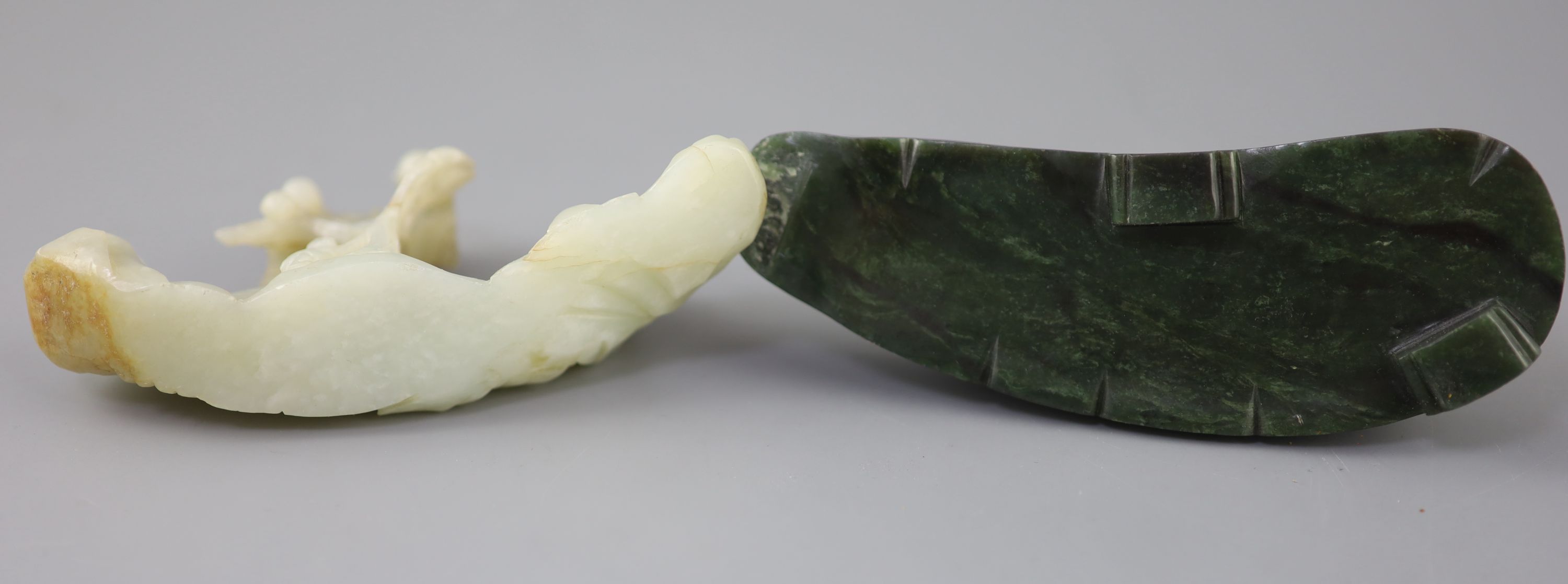 A Chinese pale celadon jade boulder carving, Qing dynasty, 13cm wide, the spinach green jade stand probably later